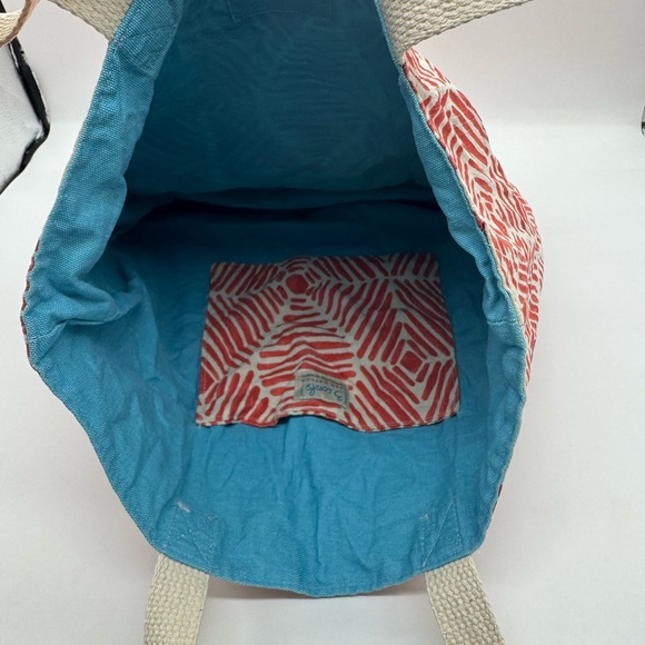 Arbonne Brand Tote Bag featuring geometric red and white pattern. - Picture 3 of 4